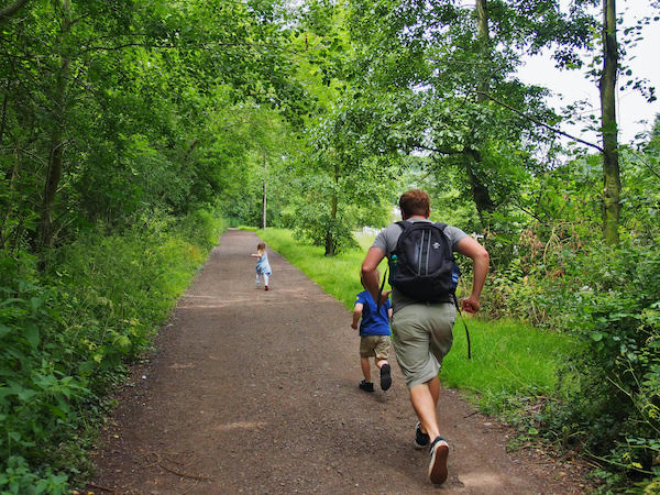 Joel running with his kids